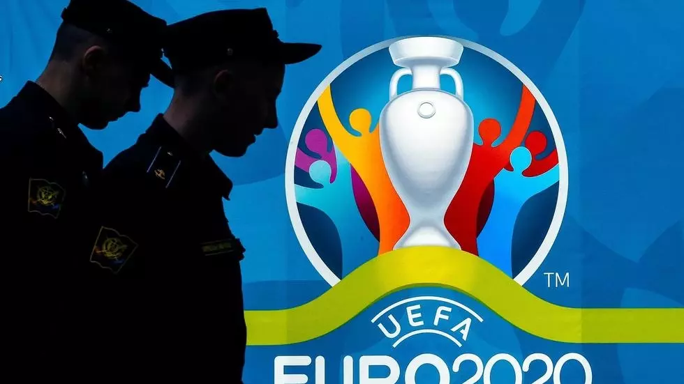 Police officers walking past a UEFA Euro 2020 in Saint Petersburg Olga MALTSEVA AFP/File