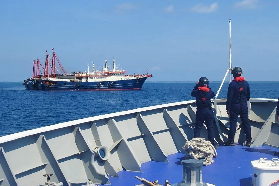 Philippine coastguard personnel aboard the BRP Cabra monitor Chinese vessels anchored at Sabina Shoal, a South China Sea outcrop claimed by both Manila and Beijing. Photo: AFP Philippine coastguard personnel aboard the BRP Cabra monitor Chinese vessels anchored at Sabina Shoal, a South China Sea outcrop claimed by both Manila and Beijing. Photo: AFP