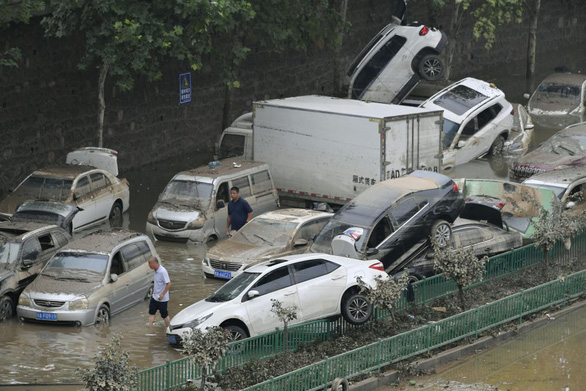 China Flooding: Death Toll Rises to 56, Losses Mount to $10 Billion China Flooding: Death Toll Rises to 56, Losses Mount to $10 Billion
