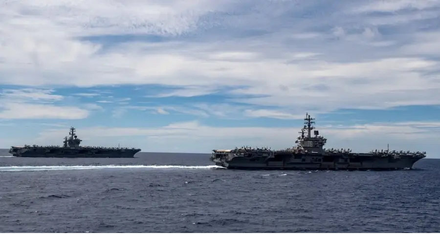 Nimitz-class aircraft carriers USS Nimitz and USS Ronald Reagan in the South China Sea. U.S. Navy photo by Mass Communication Specialist 3rd Class Cody Beam 1108 us navy 2