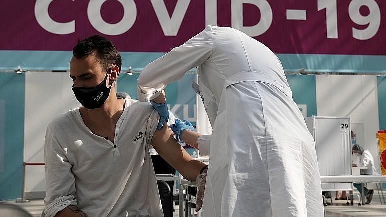 A medical worker administers a shot of Russia's Sputnik V coronavirus vaccine at a Moscow vaccination centre on July 12, 2021. A medical worker administers a shot of Russia's Sputnik V coronavirus vaccine at a Moscow vaccination centre on July 12, 2021.