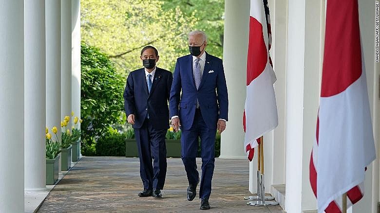 US President Joe Biden and Japan's Prime Minister Yoshihide Suga walk through the Colonnade to take part in a joint press conference in the Rose Garden of the White House in Washington, DC on April 16, 2021. US President Joe Biden and Japan's Prime Minister Yoshihide Suga walk through the Colonnade to take part in a joint press conference in the Rose Garden of the White House in Washington, DC on April 16, 2021.