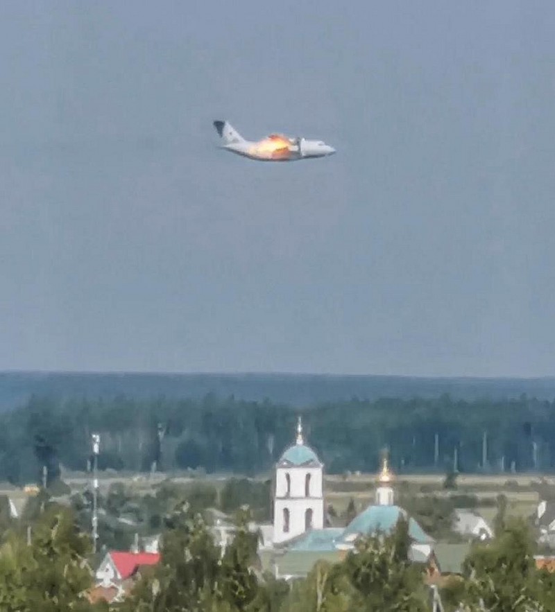 In this handout photo taken from video provided by Dmitry Ovchinnikov, The new light military transport burning plane Il-112V flies near Kubinka airfield about 45 kilometers (28 miles) west of Moscow, Russia, Tuesday, Aug. 17, 2021. The prototype military transport plane crashed while performing a test flight outside Moscow on Tuesday, Russian news agencies reported, citing Russia's United Aircraft Corporation. The new light military transport plane, Il-112V, crashed in a forested area as it was coming in for a landing at the Kubinka airfield about 45 kilometers (28 miles) west of Moscow, spokespeople of the corporation told the Tass news agency. (Dmitry Ovchinnikov via AP) In this handout photo taken from video provided by Dmitry Ovchinnikov, The new light military transport burning plane Il-112V flies near Kubinka airfield about 45 kilometers (28 miles) west of Moscow, Russia, Tuesday, Aug. 17, 2021. The prototype military transport plane crashed while performing a test flight outside Moscow on Tuesday, Russian news agencies reported, citing Russia's United Aircraft Corporation. The new light military transport plane, Il-112V, crashed in a forested area as it was coming in for a landing at the Kubinka airfield about 45 kilometers (28 miles) west of Moscow, spokespeople of the corporation told the Tass news agency. (Dmitry Ovchinnikov via AP)