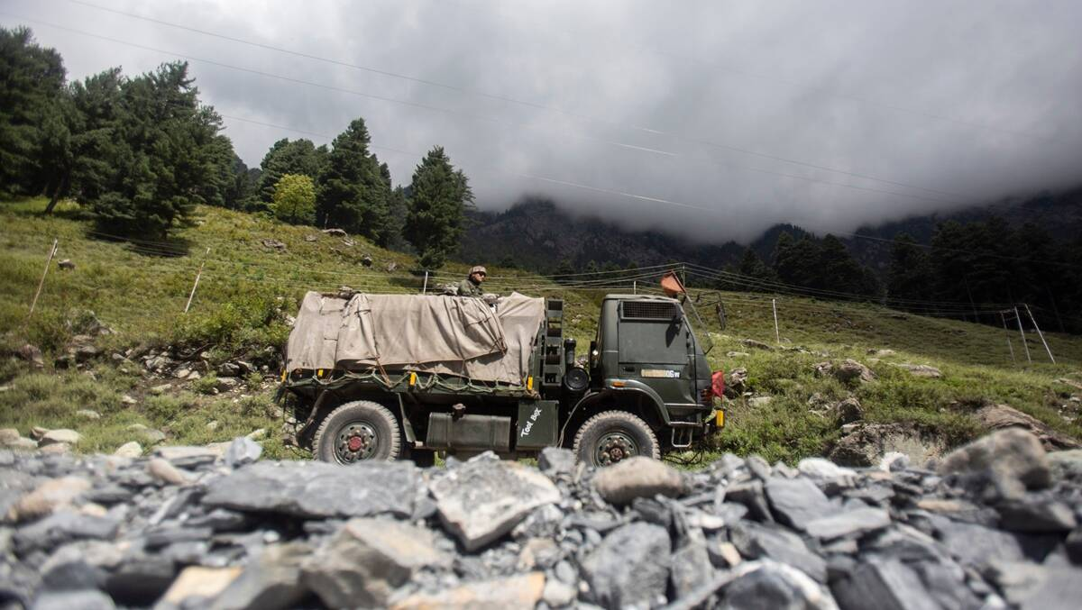 An Indian army soldier guard on top of his vehicle as their convoy moves on the Srinagar- Ladakh highway at Gagangeer, northeast of Srinagar, Indian-controlled Kashmir, Tuesday, Sept. 1, 2020. (AP Photo) 2522 soldier