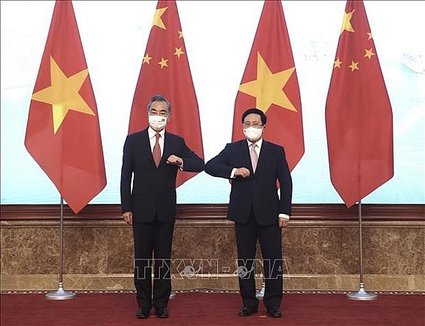 Politburo member and Standing Deputy Prime Minister Pham Binh Minh (R) and Chinese State Councilor and Foreign Minister Wang Yi  (Photo: VNA)