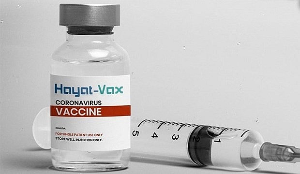 A woman receives a Covid-19 vaccine shot in HCMC's Thu Duc City, August 15, 2021. Photo: VnExpress A woman receives a Covid-19 vaccine shot in HCMC's Thu Duc City, August 15, 2021. Photo: VnExpress