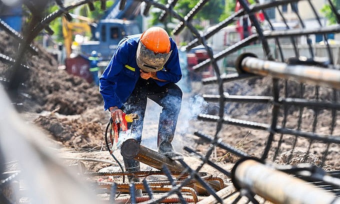 A man works on a construction site in Hanoi on June 21, 2021. Photo by VnExpress/Giang Huy. A man works on a construction site in Hanoi on June 21, 2021. Photo by VnExpress/Giang Huy.