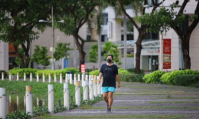 A man walks in Canh Doi Park in District 7, HCMC, September 21, 2021. Photo by VnExpres A man walks in Canh Doi Park in District 7, HCMC, September 21, 2021. Photo by VnExpres