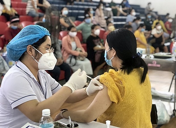 A pregnant woman gets vaccinated against COVID-19 in Quy Nhon city of Binh Dinh province (Photo: VNA) A pregnant woman gets vaccinated against COVID-19 in Quy Nhon city of Binh Dinh province (Photo: VNA)