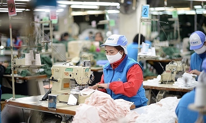Employees at a textile factory in Hanoi. Photo by VnExpress 0743 textile