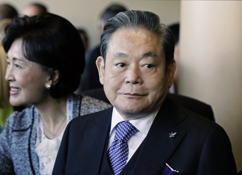 In this July 6, 2011, file photo, Samsung Chairman Lee Kun-hee, right, greets people from the South Korean delegation in Durban, South Africa, for the 123rd International Olympic Committee (IOC) session that will decide the host city for the 2018 Olympics Winter Games. Lee, the ailing Samsung Electronics chairman who transformed the small television maker into a global giant of consumer electronics, has died, a Samsung statement said Sunday, Oct. 25, 2020. He was 78. (AP Photo/Schalk van Zuydam, File) 5907 lee