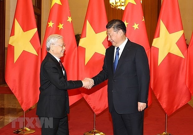 General Secretary of the Communist Party of China Central Committee and President of China Xi Jinping (R) welcomes General Secretary of the Communist Party of Vietnam Central Committee Nguyen Phu Trong during the latter's visit to China in 2017 (Photo: VNA) General Secretary of the Communist Party of China Central Committee and President of China Xi Jinping (R) welcomes General Secretary of the Communist Party of Vietnam Central Committee Nguyen Phu Trong during the latter's visit to China in 2017 (Photo: VNA)
