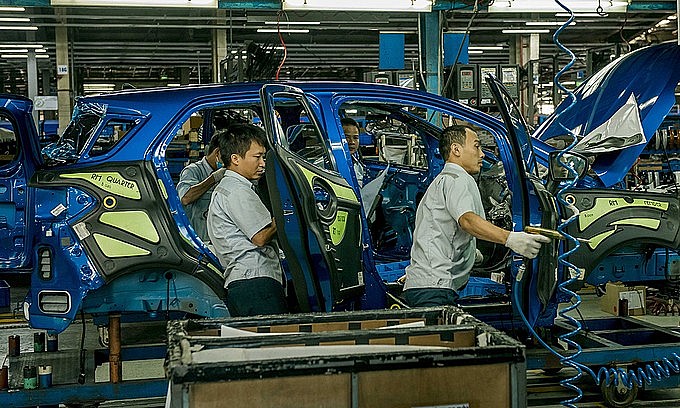 Workers assemble cars in a factory of Ford in the northern province of Hai Duong. Photo courtesy of Ford Vietnam. Workers assemble cars in a factory of Ford in the northern province of Hai Duong. Photo courtesy of Ford Vietnam.