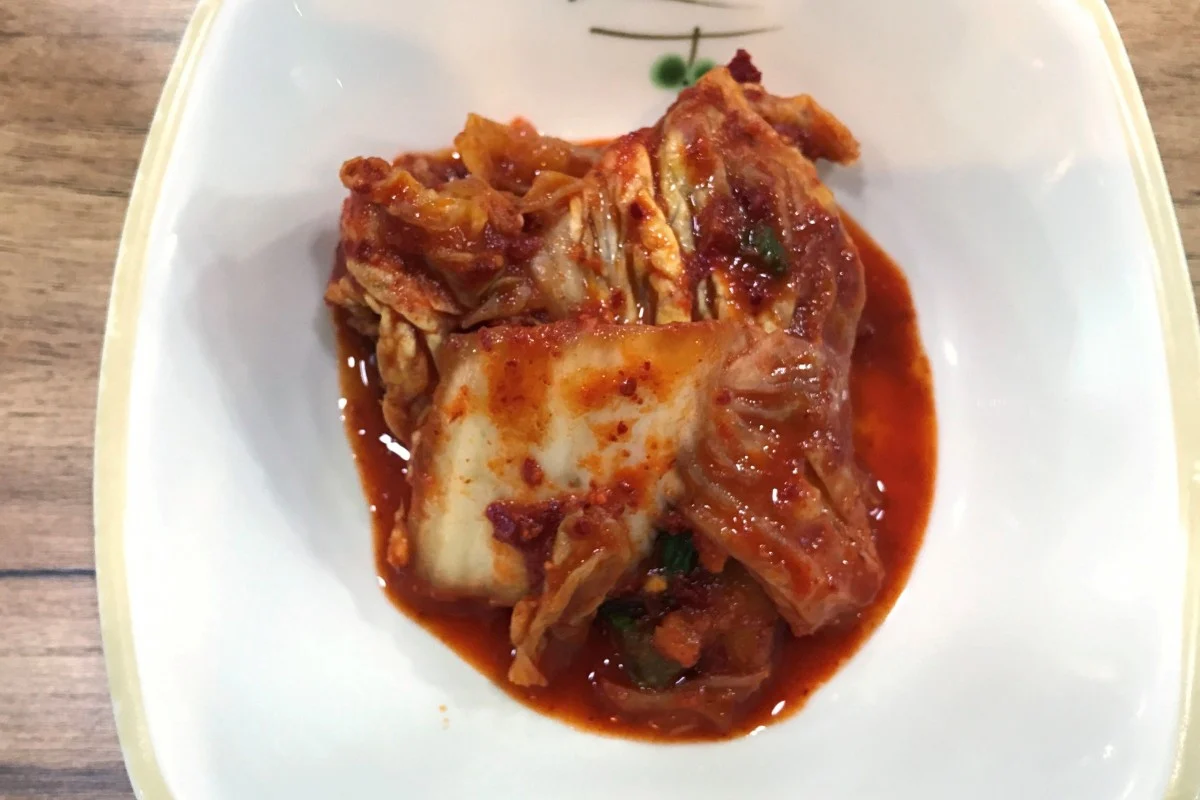 A plate with traditional Korean kimchi – made of cabbages seasoned with spices – is seen on a table of a restaurant in Seoul. Photo: Reuters 4856 kimchi2