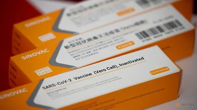 A display shows packages of the vaccine candidate for SARS-CoV-2 by Sinovac Biotech in Beijing, China, Sep 24, 2020. (File photo: REUTERS/Thomas Peter) 2025 vaccine