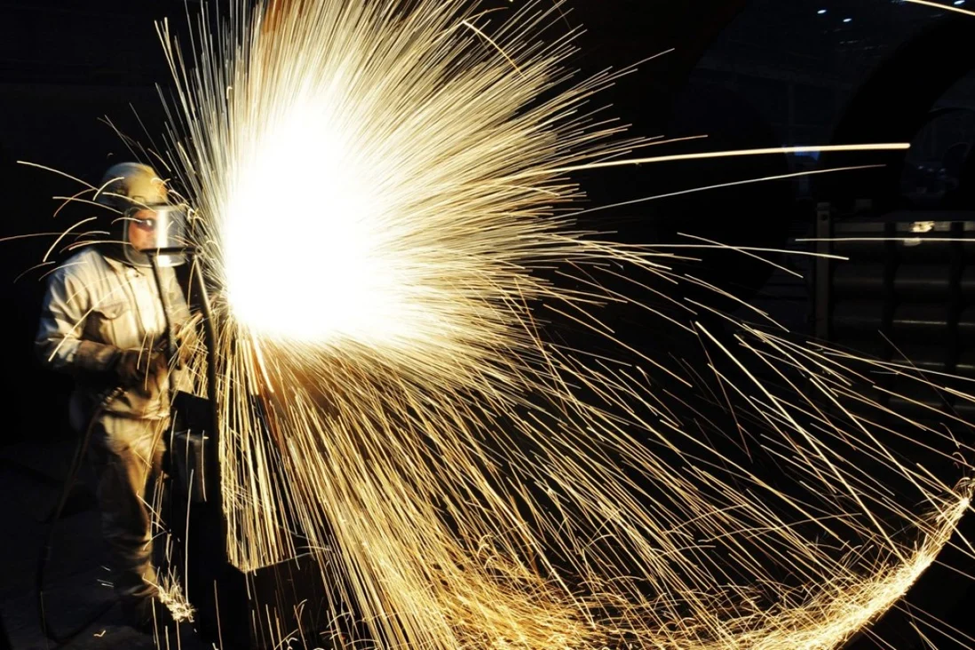 A file picture of a worker cutting steel in Qingdao in China's eastern Shandong province. Photo: Agence France-Presse 5442 steel 1