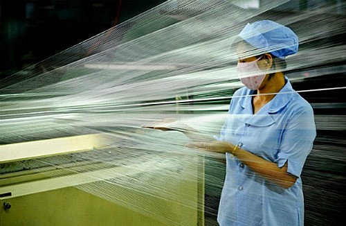 A worker at a garment and textile firm in Vietnam. Photo: VnExpress A worker at a garment and textile firm in Vietnam. Photo: VnExpress
