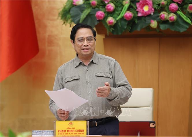 Thủ tướng: Nghiên cứu giải pháp thích ứng an toàn, linh hoạt, kiểm soát có hiệu quả dịch COVID-19 Chú thích ảnh