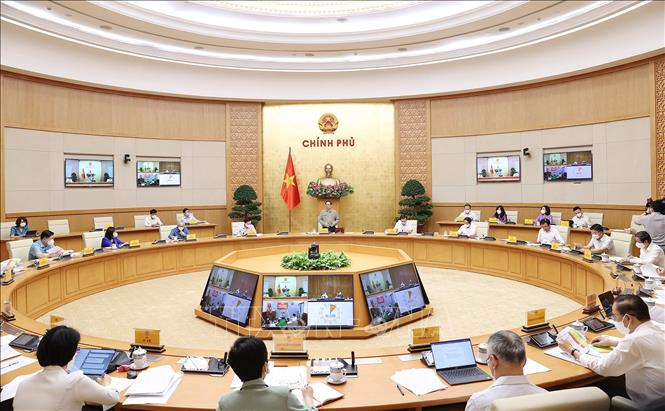 Thủ tướng: Nghiên cứu giải pháp thích ứng an toàn, linh hoạt, kiểm soát có hiệu quả dịch COVID-19 Chú thích ảnh
