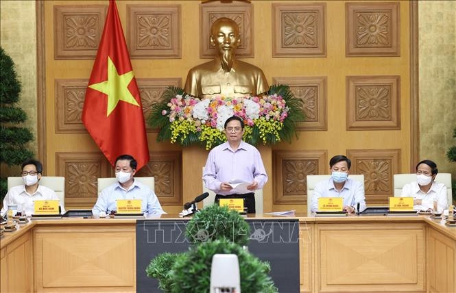 ທ່ານນາຍົກລັດຖະມົນຕີຫວຽດນາມ ຟ້າມມິນຈິງ,  ໄດ້ພົບປະກັບການນຳບັນດາອົງການສື່ມວນຊົນ (ພາບ: TTXVN)
