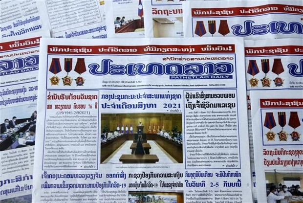 ໜັງສືພິມ Pathet Lao Daily ຂອງ ສຳນັກຂ່າວສານປະເທດລາວ (ພາບ: TTXVN) ໜັງສືພິມ Pathet Lao Daily ຂອງ ສຳນັກຂ່າວສານປະເທດລາວ (ພາບ: TTXVN)