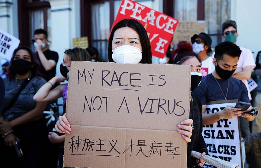 People demonstrate against anti-Asian violence and racism on March 27, 2021 in Los Angeles. Mario Tama/Getty Images. 1606-an-4