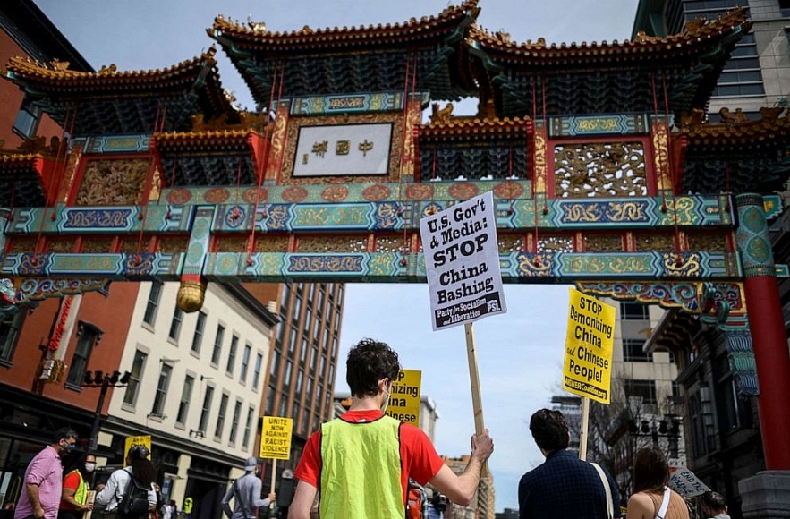 People participate in an 'Anti Asian Hate' rally in Chinatown in Washington, DC on March 27, 2021. Andrew Caballero-reynolds/AFP via Getty Images 1608-asian-2