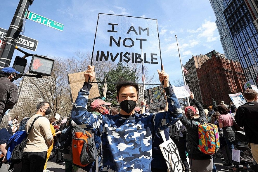 Asian Americans are gathered at the City Hall to protest Asian-Hate in New York City, March 27, 2021. Anadolu Agency via Getty Images. 2013-asian-12