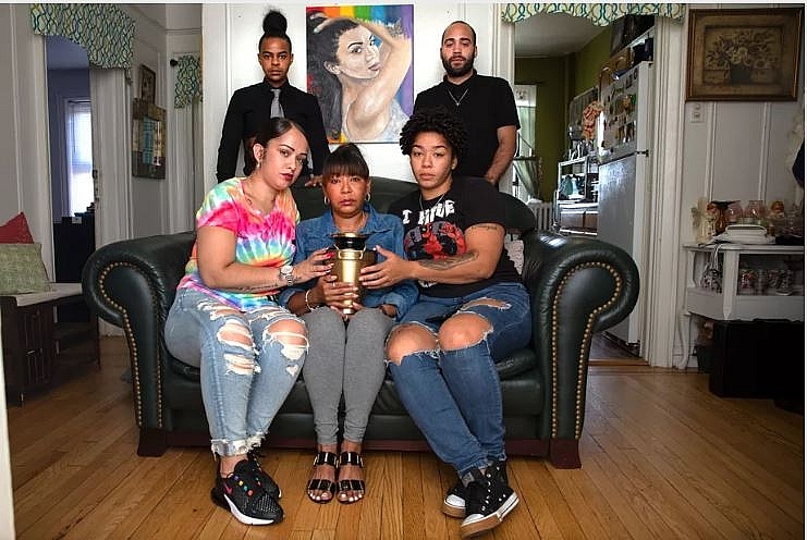 Layleen Polanco’s family and friends — clockwise: brother Saloman Polanco; best friend Ramon Monclus; sister Melania Brown; mother Aracelis Polanco; and best friend Amanda Collaszo — hold the transgender woman’s ashes while posing in her Yonkers family home, Aug. 5, 2019. Photo: Ben Fractenberg/THE CITY 1223 layleen