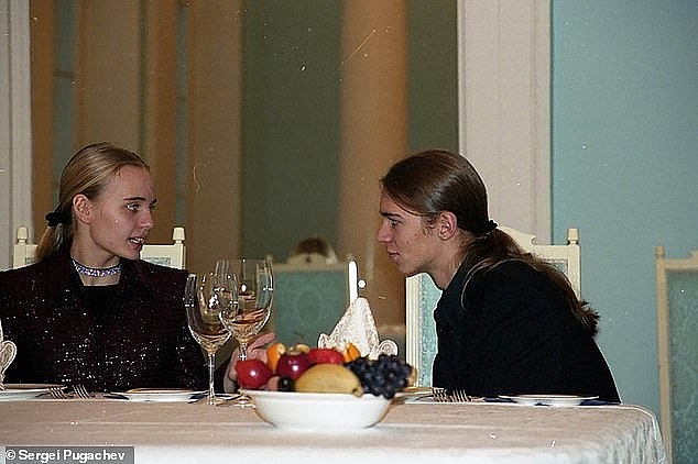 Maria Putina and Viktor Pugachev chat during a private party at former Putin crony Sergei Pugachev's country house. Photo: Daily Mail 0454 putin daughter 4