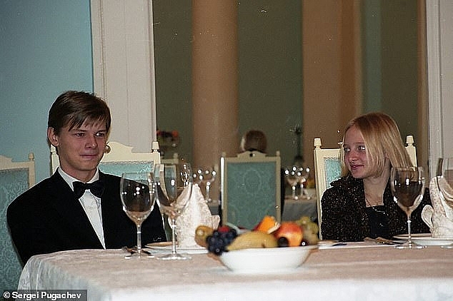 Katerina Putina looks at Pugachev's son Alexander during a party at his country house in the early 2000s. Photo: Daily Mail 0607 putin daughter 5