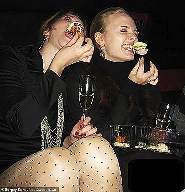 Little is known of Maria (pictured enjoying a takeaway meal and champagne, right), but she is said to be a fan of Little Britain starring David Walliams and Matt Lucas, and she listed her favourite book as 'Memoirs of a Geisha' by Arthur Golden. Photo: Daily Mail 1327 putin daughter 7