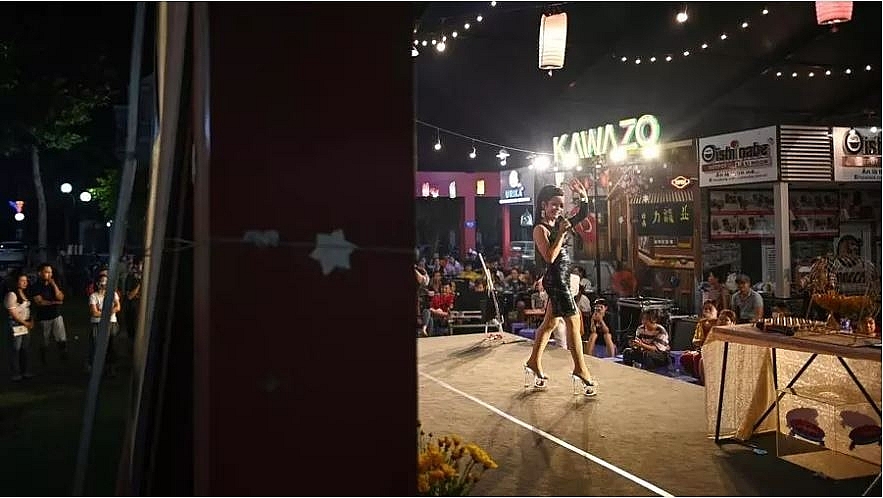 Nha Vy sings, dances and deals out lotto tickets at her tri-weekly shows with the Sai Gon Tan Thoi LGBT troupe Manan. Photo: VATSYAYANA AFP 5651 lgbt vietnam