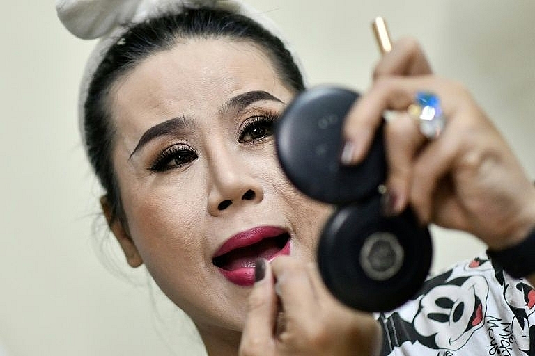 'We perform with our sweat, tears and blood,' says La Kim Quyen of the Sai Gon Tan Thoi LGBT lotto troupe in Vietnam. Photo: AFP 0232 lgbt vietnam 5
