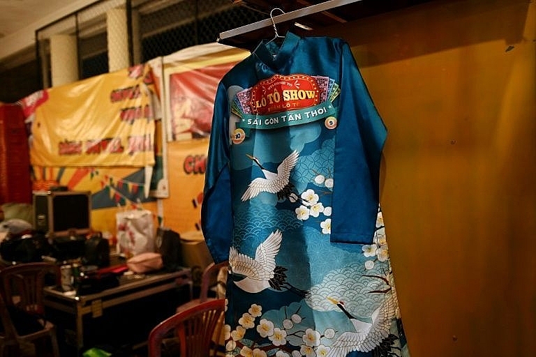 A traditional Vietnamese ao dai dress worn by a member of the Sai Gon Tan Thoi LGBT lotto troupe. Photo: AFP 0332 lgbt vietnam 6