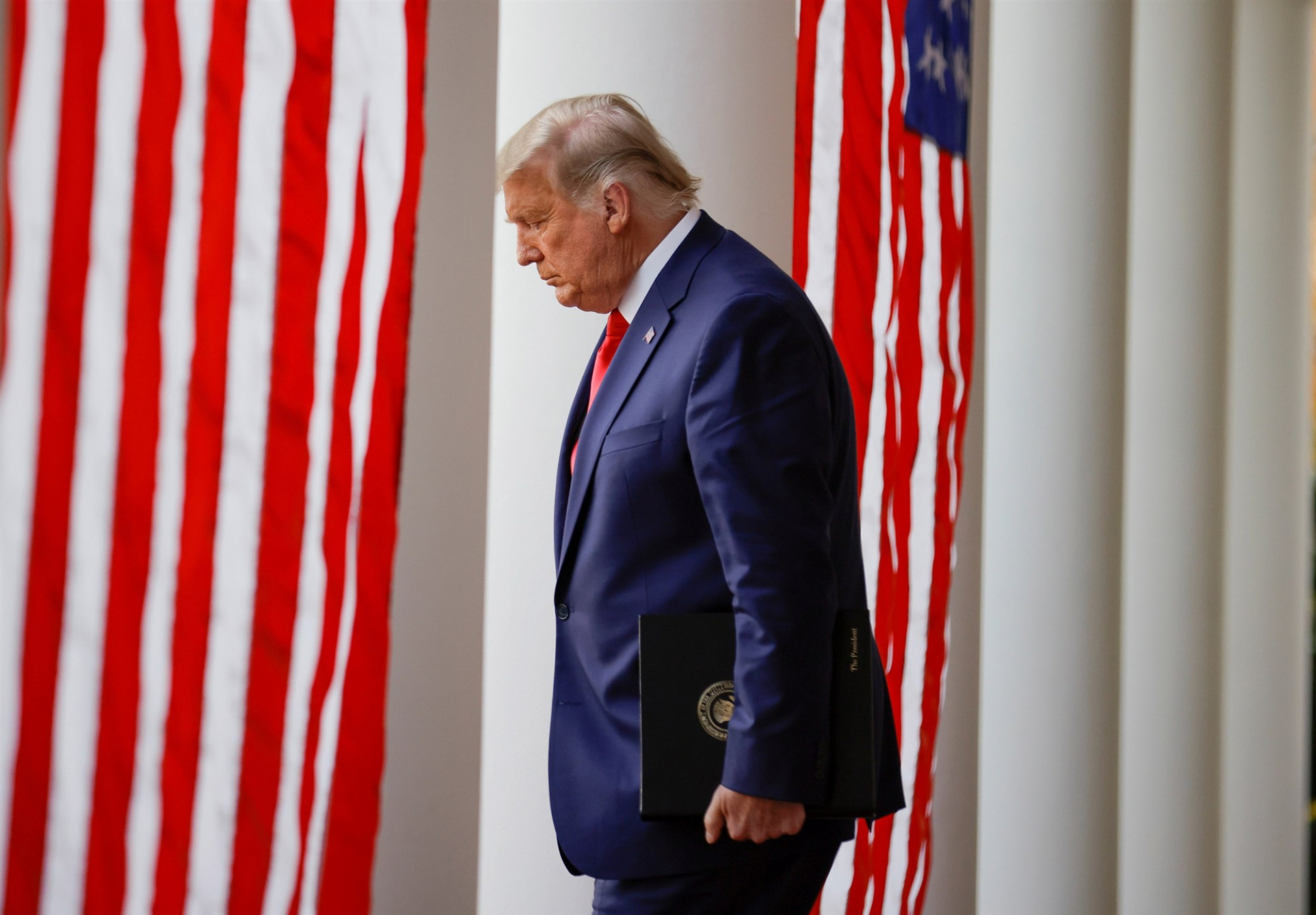 President Donald Trump walks down the West Wing colonnade from the Oval Office of the White House to the Rose Garden in November.Carlos Barria / Reuters file 0344 bi3