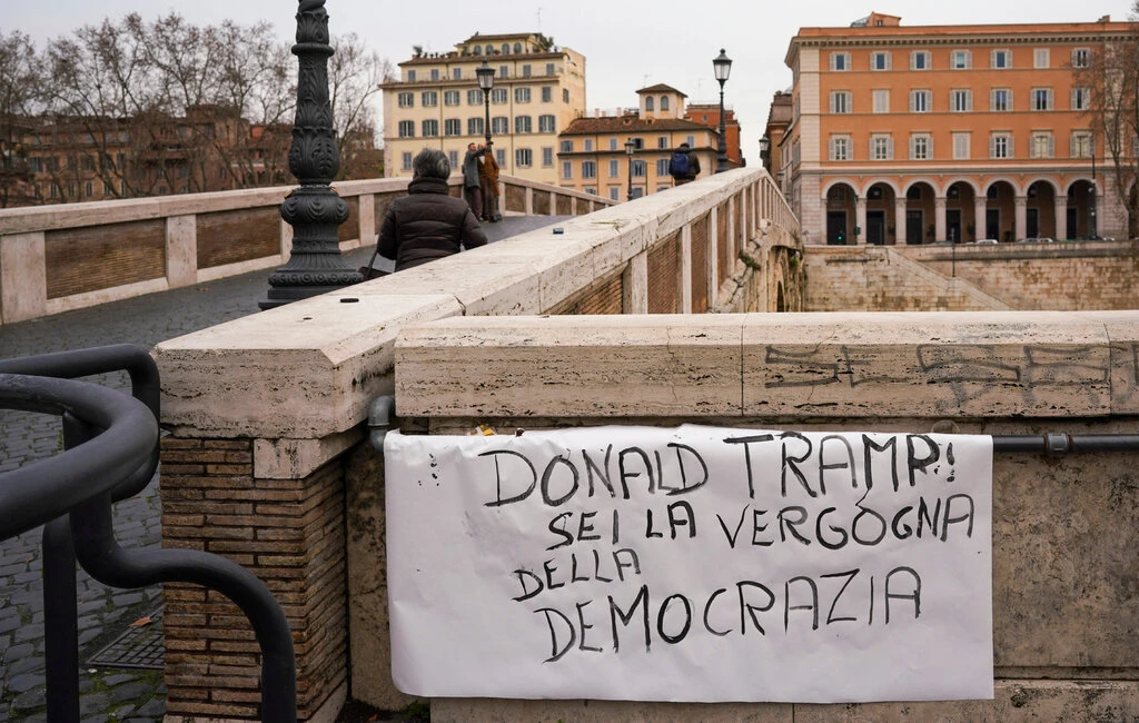 A sign in Rome reading, “Donald Tramp, you are the shame of democracy,” on Thursday 5438 trump