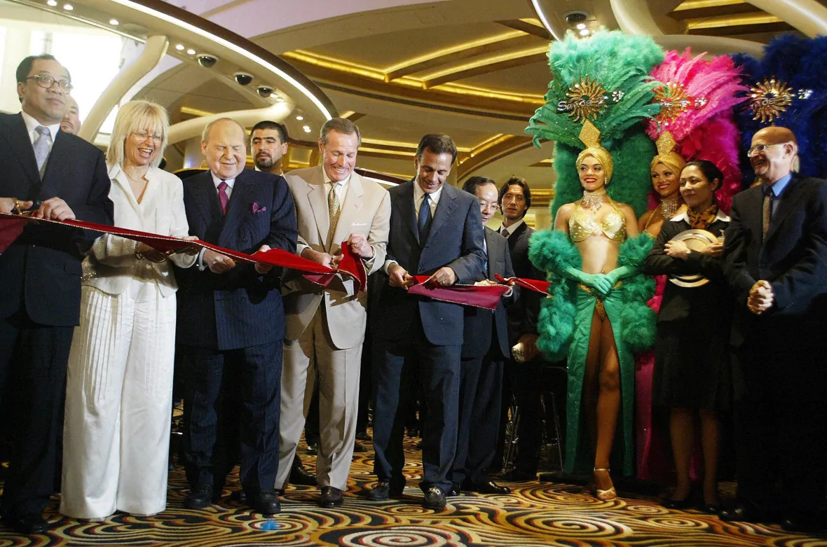 VIPs including Adelson cut the ribbon at the opening of the Sands Casino in Macau in 2004. 2743 an4
