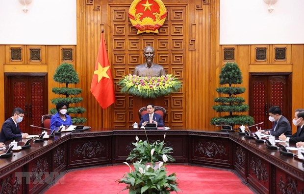 Prime Minister Pham Minh Chinh (C) speaks at the meeting (Photo: VNA) Prime Minister Pham Minh Chinh (C) speaks at the meeting (Photo: VNA)