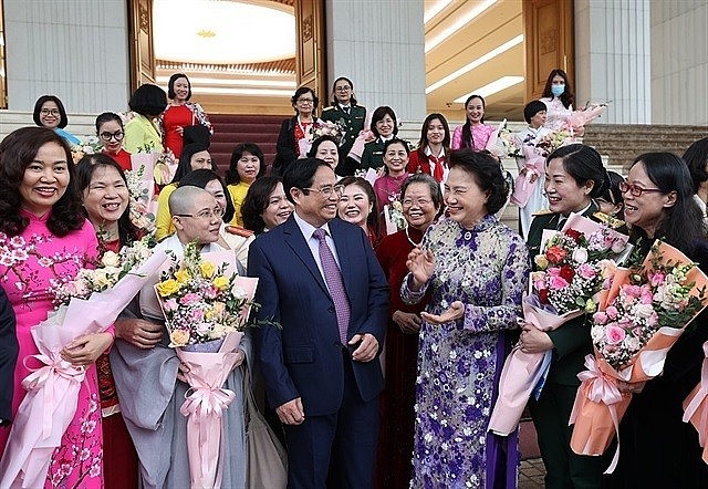 Prime Minister Phạm Minh Chính meets women representatives in Hà Nội on Tuesday on Vietnamese Women's Day (October 20). —VNA Prime Minister Phạm Minh Chính meets women representatives in Hà Nội on Tuesday on Vietnamese Women's Day (October 20). —VNA