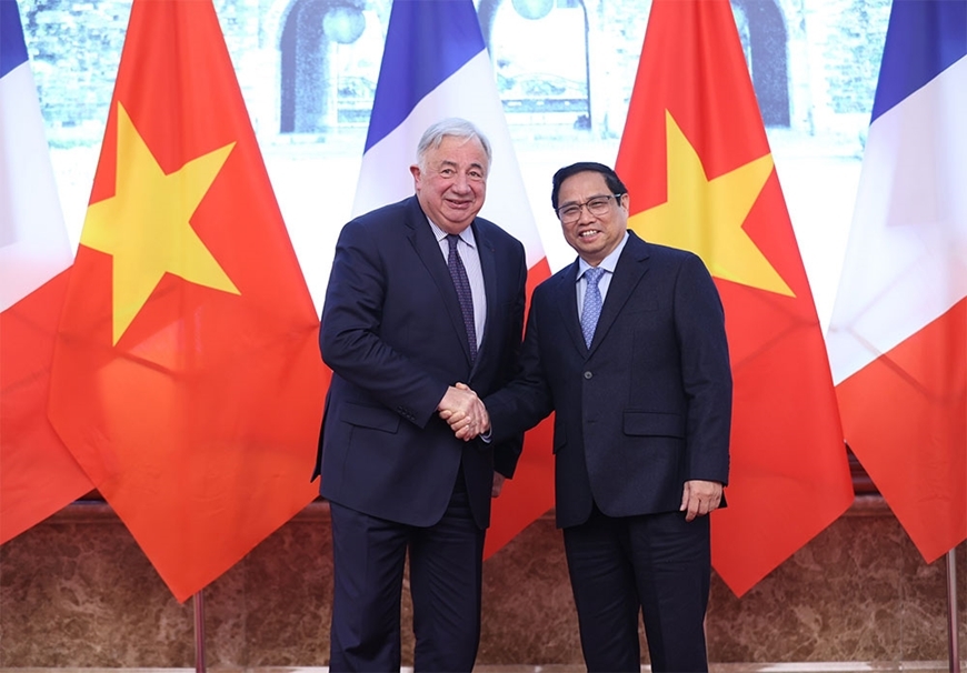 越南政府总理范明正与法国参议院议长热拉尔·拉尔歇。图自人民军队报
