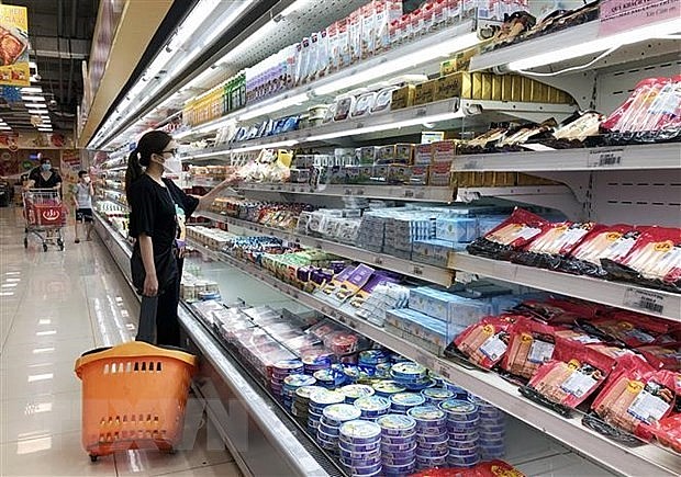 Consumers shop at a Co.opXtra supermarket in HCM City. Photo: VNS Consumers shop at a Co.opXtra supermarket in HCM City. Photo: VNS