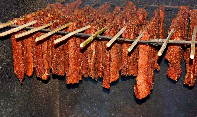 Cooking smoked buffalo: a must-try dish of the Thai ethnic group Cooking smoked buffalo: a must-try dish of the Thai ethnic group
