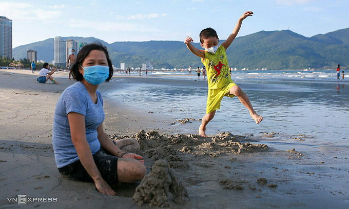 People on a beach in Da Nang City on June 9, 2021. Photo: VnExpress People on a beach in Da Nang City on June 9, 2021. Photo: VnExpress
