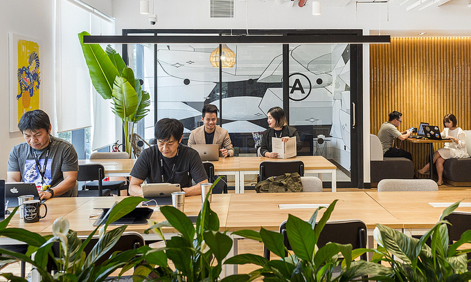 Staff work at a coworking space in HCMC's District 1. Photo: VnExpress Staff work at a coworking space in HCMC's District 1. Photo: VnExpress