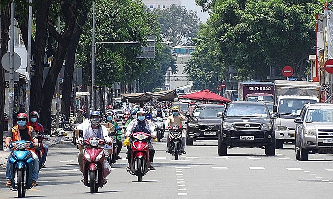 People drive on Vo Thi Sau Street in District 3, HCMC, August 2021. Photo: VnExpress People drive on Vo Thi Sau Street in District 3, HCMC, August 2021. Photo: VnExpress