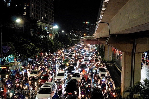 Personal vehicles on a street in Hanoi in the rush hour. Photo: VNA Personal vehicles on a street in Hanoi in the rush hour. Photo: VNA