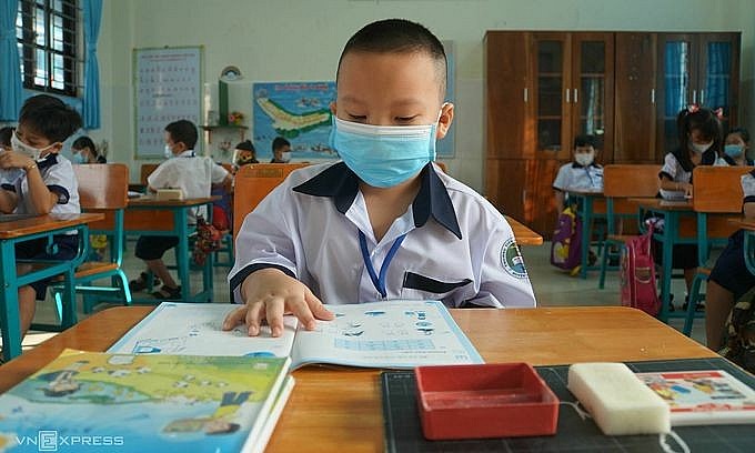 First graders attend an in-person class at Thanh An Primary School in HCMC's outlying district of Can Gio, October 20, 2021. Photo: VnExpress First graders attend an in-person class at Thanh An Primary School in HCMC's outlying district of Can Gio, October 20, 2021. Photo: VnExpress