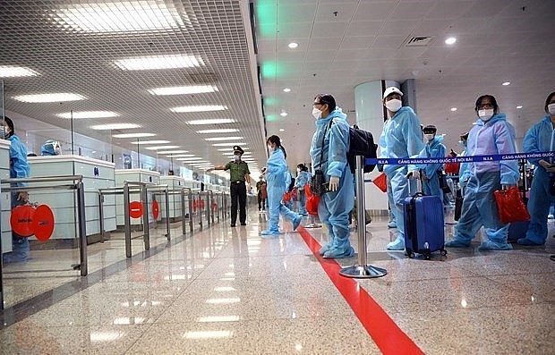 Passengers wait to handle procedures at Noi Bai International Airport in Hanoi. Photo: VNA Passengers wait to handle procedures at Noi Bai International Airport in Hanoi. Photo: VNA