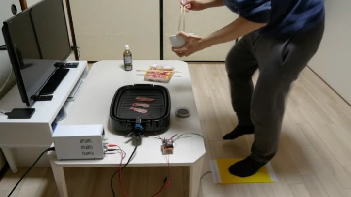 Human-powered grill that makes you work for your food